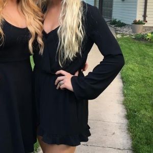 Worn once. Boutique black romper with ruffle detail. Size small.